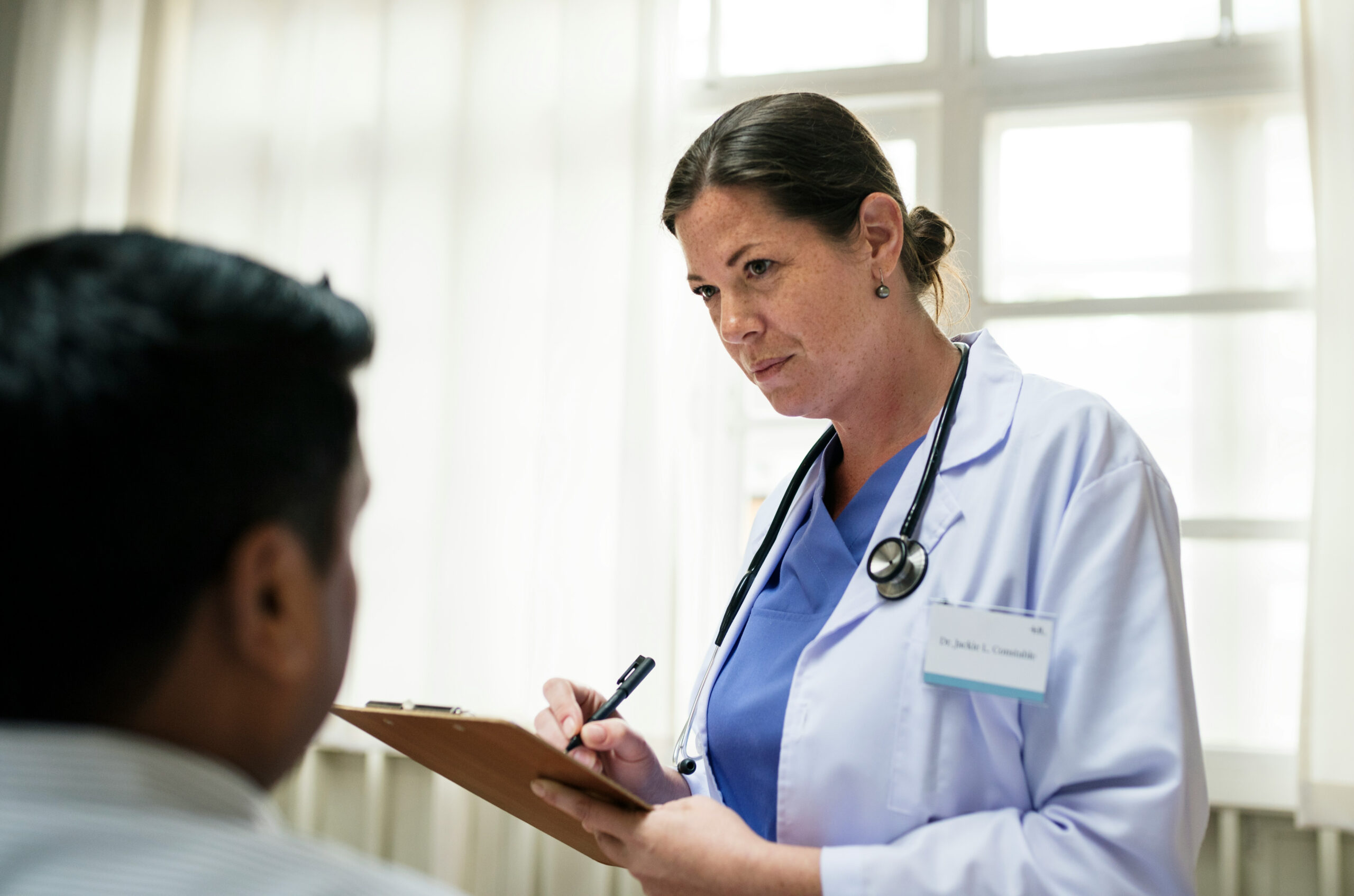 Nephrology provider reviewing a personalized kidney and blood pressure treatment plan with a patient