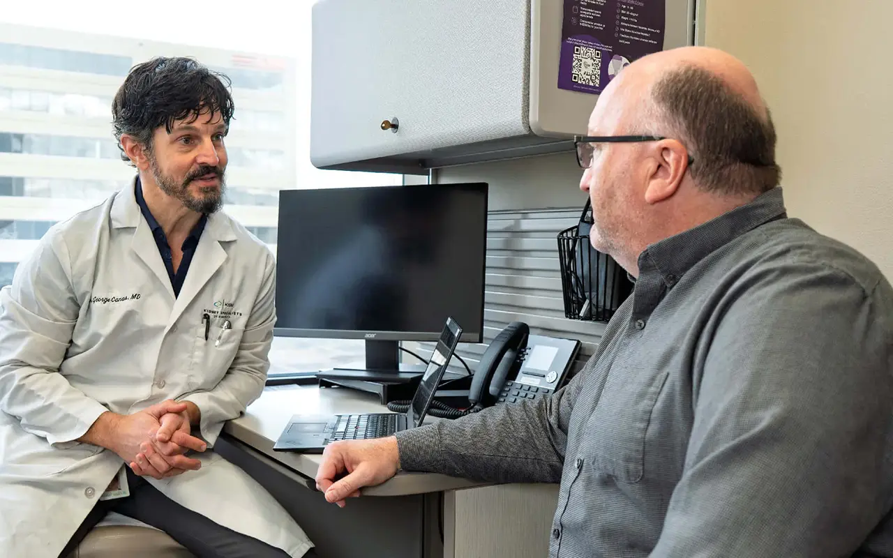 KSM physician talking with patient in clinic 2